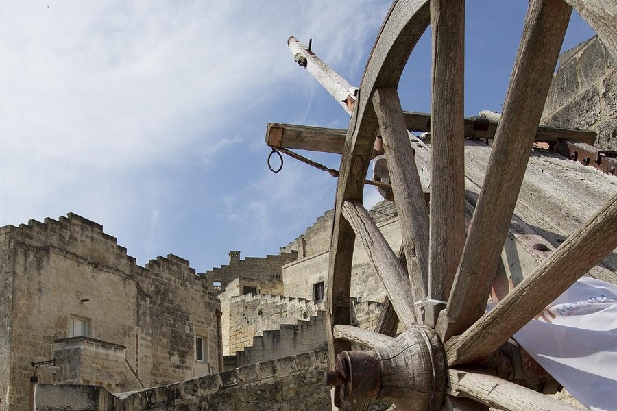 Antique wagon wheel on Sassi steps